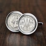 Pair of 1958 Australian threepence cufflinks in silver bezels, wheat-ears reverse facing out, on dark wood