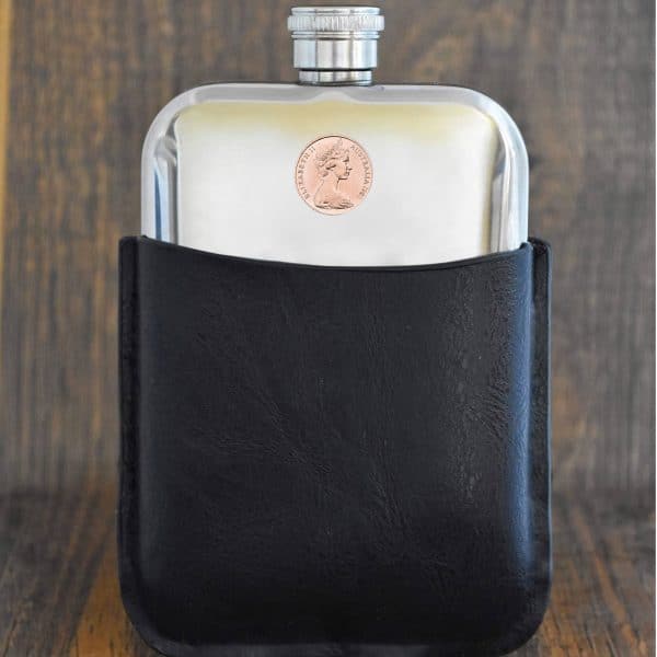 1983 Australian coin with Elizabeth II portrait set into a polished pewter hip flask in a black leather sleeve