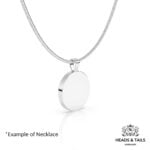 Plain back of a round silver bezel pendant on a snake chain, no coin visible from this side
