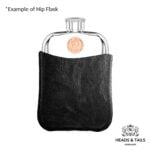 Copper Australian coin with Elizabeth II portrait on a pewter hip flask held in a black leather sleeve
