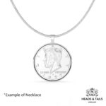 1977 US Kennedy half dollar in a polished silver bezel pendant on a silver snake chain, shown front on