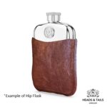 2000 US Jefferson nickel set into a polished pewter hip flask in a brown leather sleeve, angled view