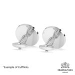 Backs of a pair of silver coin cufflinks, showing plain polished discs and swivel bar fittings