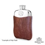 Pewter hip flask in a brown leather sleeve at an angle, 1967 US quarter set into the front