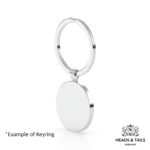 Back of a plain polished silver disc bezel on a split-ring keyring, angled on a white background