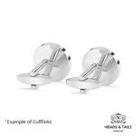 Backs of a pair of silver cufflinks, plain round discs with swivel bar fittings, on a white background